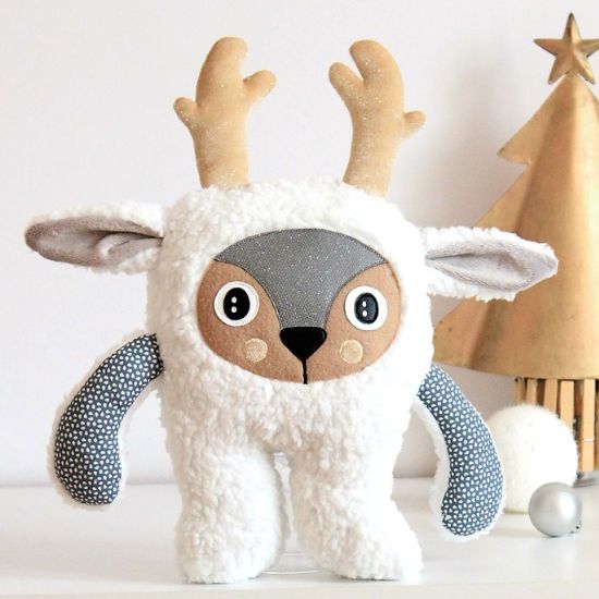 Peluche renne blanc avec des bois en tissu pailleté